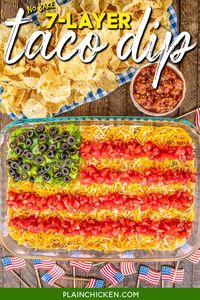 7 Layer Taco Dip in Flag Shape - such a fun and patriotic no-bake dip for Memorial Day, 4th of July, and Labor Day! Can just layer the dip ingredients if not serving for a patriotic holiday. Refried beans, diced green chiles, guacamole, taco seasoning, sour cream, corn, cheese, tomatoes, green onions, and olives. Can add ground beef, chicken, lettuce, onions, bell peppers - whatever you like! Make in advance and refrigerate for later.