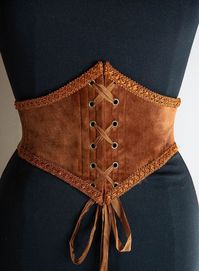 Do you like corsets but also like to feel comfortable in your clothes? This belt is made for you! This is an elastic waist cincher, made of quality copper velvet. Steel bones on the front of the belt provide support and give the illusion that it is a real corset. The sturdy elastic that makes up the back of this accessory provides greater sheathing than a classic belt and will adapt perfectly to your size. Possibility to choose this model with braid or only with a cotton border. Item handmade in France (and with great care