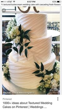 White wedding cake with texture and flowers