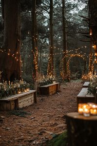 A woodland path is adorned with glowing string lights and lined with wooden benches. The setting is enhanced with flowers and candles, creating a cozy and enchanting atmosphere in a forest.