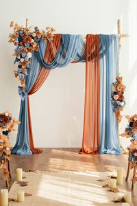 This arch decoration set contains floral arrangements and polyester drapes. Design for your wedding ceremony backdrop, wedding aisle archway decoration, sweetheart table flower decor, and bride's and groom's chair back decor. PACKAGE DETAILS: Package: Set of 5, including large corner flower swag x1, tie-back flower x1,