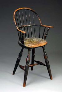 PENNSYLVANIA CHILD'S BOWBACK WINDSOR HIGH CHAIR IN OLD SURFACE, LATE EIGHTEENTH CENTURY. The bowed back over seven spindles flanked by shaped arms over a shaped seat raised on vase and ring-turned splayed legs joined by an H-stretcher.    Literature: For a similar example, see Albert Sack's "Fine Points of Furniture, Early American" p. 86. Sold at Northeast Auctions August 3-5, 2012.