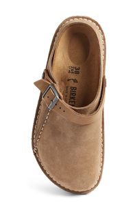 A convertible slingback strap adds dual functionality and styling options to a classic suede clog grounded by a contoured, arch-supporting footbed. Adjustable slingback strap with buckle closure Contoured cork footbed with arch support Leather upper and lining/synthetic sole Imported