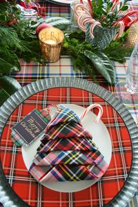 Plaid Tidings Christmas Table and Christmas Tree Napkin Fold | homeiswheretheboatis.net #Christmas #tablescape #tartan #plaid