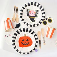 Set the table + celebrate Halloween with your closest BOOs! This Halloween Mini Party Kit features fun friends and makes it effortless to host and serve up your spookiest foods, snacks, and celebratory drinks! Perfect for any pre Trick-or-Treating celebration, classroom party, costume party, or pumpkin-carving get together! This set includes:  (8) lunch plates (9in) (8) cake plates (7in)  (8) paper cups (8) mini napkins, 2 of each design: witch, skeleton, ghost, pumpkin (8) wooden forks (8) wooden spoons Pair with our Halloween handouts for kids for even more spooky fun!