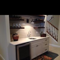 Nice basement wet bar, with open shelves