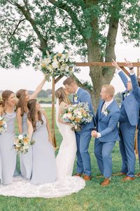 A beautiful spring garden wedding | blue bridesmaid dresses | blue groomsmen suits