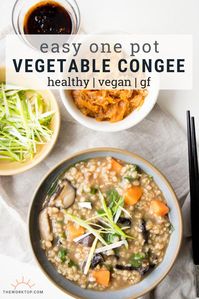 This vegetable congee recipe is healthy and delicious. Made with brown rice and loaded with vegetables. We really enjoy this Chinese rice dish for breakfast breakfast, particularly on a cold day. This congee recipe is vegan, vegetarian and gluten free. Recipe on www.theworktop.com. || #congee #asianrecipes #veganrecipeshealthy #glutenfree #breakfast