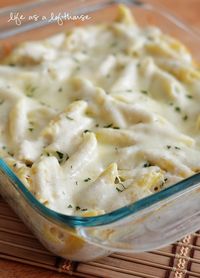 Ingredients:    1 (16 ounce) box Penne pasta noodles  2 (10 ounce) containers Alfredo sauce  1 cup sour cream  1 (15 ounce) container Ricotta cheese  2 cloves of garlic, minced  2 cups cooked, diced chicken  1/4 cup grated Parmesan cheese  2 teaspoons dried Parsley  1 teaspoon Italian seasoning  2