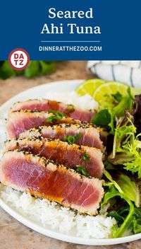 This seared ahi tuna recipe is sashimi grade fish coated in sesame seeds, then briefly cooked to tender and flavorful perfection. Add a drizzle of sauce and some fresh herbs for a light and delicious dinner option.