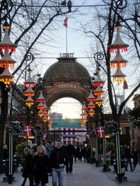 Tivoli Garden's Main Entryway, Copenhagen. Tivoli Gardens is a famous amusement park and pleasure garden in Copenhagen, Denmark. The park opened on August 15, 1843, and is the second oldest amusement park in the world.