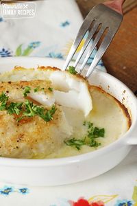 This baked cod is hands-down my favorite fish dish. It turns out perfectly flaky every time. The flavorful, creamy sauce puts it over the top! #cod #bakedcod #fish #bakedfish #howtocookfish #broiledfish #fishdish #fishdinner #whitefish #cookedfish #dinner