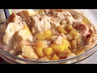 This Peach Cobbler Bread Pudding combines fresh peaches, brioche, spices, and custard ingredients baked to perfection then topped with bourbon cream sauce!