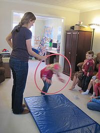 have kids jump through hoola hoop .  but need mat for safety