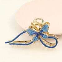 Description:Butterfly Chignon Hair Claw Clip Specification:Metals Type: Alloy Metal, EnamelWeight: 41 g/pcSize: 10.6 cm * 2.6 cmColor: Pink/Blue/Yellow/Green Add a touch of whimsy to your hair with our Butterfly Chignon Hair Claw Clip! This clip features a playful butterfly design that will elevate any hairstyle. Easy to use and secure, it's the perfect accessory for adding a fun twist to your everyday look. 🦋