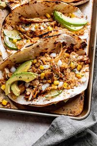 You won't believe how quickly these Instant Pot Chicken Carnitas Tacos come together! This popular Mexican recipe includes perfectly tender and crispy chicken cooked in a fresh citrus sauce plus flavorful spices. The Instant Pot is the easiest way to make crispy and delicious chicken carnitas.