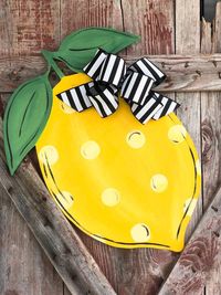 Perfect for your front door this summer! This aDOORable lemon shaped door hanger with a whimsical black and white bow will look great on the front porch to greet your guests. www.j2jgrowthcharts.etsy.com