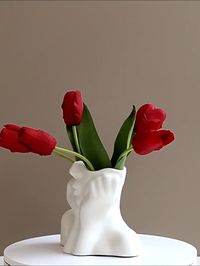 Elevate your floral arrangements with the Effie Flower Vase. A stunning fusion of artistry and functionality. Crafted from white ceramic, these vases exude timeless elegance, enhanced by delicate elements of female faces that adorn their surface. Available in three captivating styles, each vase offers a unique interpretation of feminine beauty, adding a touch of grace to any space.