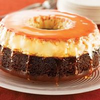 Flan Cake  Ingredients:Nonstick cooking spray,1 cup granulated sugar,8 large egg yolks,1 can (14 oz) NESTLÉ LA LECHERA Sweetened Condensed Milk,1 can (12 fluid oz) NESTLÉ® CARNATION® Evaporated Milk,1 package (18.25 oz) devil's food cake mix. Directions: Pre heat oven to 350° F.Move oven rack to lowest position.Spray a 10-inch bundt pan with nonstick cooking spray. Place a roasting pan half filled with water in the oven...jlc