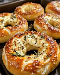 Soft, cheesy, and bursting with flavor—these pretzels are perfect for snacks or parties! 🌿✨  📝 Ingredients: All-purpose flour, yeast, warm water, sugar, salt, mozzarella sticks, butter, rosemary, Parmesan cheese, baking soda, and coarse salt.  👨‍🍳 Directions: Make dough with flour, yeast, water, sugar, and salt. Let rise. Divide, wrap dough around mozzarella sticks, and shape into pretzels. Boil in baking soda water, brush with butter, and top with rosemary, Parmesan, and coarse salt. Bake at 200°C (400°F) for 12–15 mins.  ⏰ Total Time: 1 hr 30 mins 🍽️ Servings: 8  #StuffedPretzels #MozzarellaPretzels #HomemadeSnacks #CheesyBites