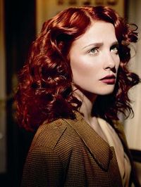 curly dark red hair