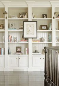 Built in white book cases cabinets, open shelving, lower cabinet doors, gorgeous staggered moldings and bead board backing!