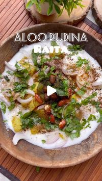 Deepali Singla on Instagram: "Aloo pudina raita 😍

 Ingredients:
- 2 medium-sized potatoes, boiled, peeled, and cubed
- 1 cup yogurt (curd)
- 1/4 cup fresh mint leaves (pudina)
- 1 green chili, chopped
-1 onion, sliced
- 1/2 tsp roasted cumin powder
- 1/2 tsp chaat masala
-1/2 tsp black salt
- Salt to taste
- Fresh coriander leaves

For tadka
- 1 tsp Ghee
- 1/4 tsp jeera
- 3-4 peanuts
- 1/4 tsp hing
- Few curry leaves
- 1/4 tsp degi mirch

#snapsnax #aloopudinaraita #summerraitarecipes #reels #reelsinstagram #reelsvideo #reelsviral #raitarecipes #aloorecipes #explore #explorepage #viralreels #raitalovers #viral #reelsindia #reelsinsta"