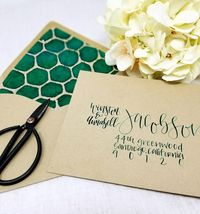 Kraft wedding envelope with green modern calligraphy! Paired with green and navy honeycomb envelope liner! Perfect for a modern rustic wedding! Or a spring garden wedding!