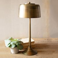 <p>Add the perfect lighting and a simple contemporary touch to any room with our<strong> Modern Sleek Antiqued Brass Table Lamp</strong>. This tall lamp, with its sleek design and antiqued brass finish, will work well in just about any room. Add this accent lamp to a bedside table or use it as an office desk lamp.</p>