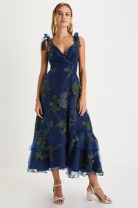 Enhance your sweet persona for the day by styling the Lulus Precious Outlook Navy Blue Floral Tie-Strap Tiered Midi Dress! Airy woven organza, with a floral jacquard motif accented by shiny gold detailing throughout, falls from tying straps into a flattering surplice neckline and a princess-seamed bodice. A high, fitted waist sits atop an A-line skirt with an overlapping faux wrap silhouette that ends at a lightly ruffled, tiered midi hem. Hidden back zipper/clasp. Fit: This garment fits true to