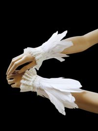 These feather cuffs are made from swan feathers and lace. They can be closed with satin ribbons and adjustable to all size. The size is 5.5inch wrist circumference (fully closed) The are 9-13 inch wide (feathers, lace). Handmade in U S A .