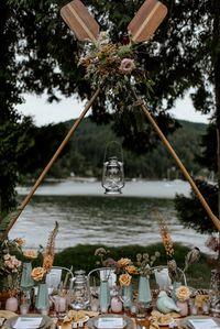 PSA: Moonrise Kindgom wedding inspiration at its MOST epic! Tents, maps, arrowheads, oars - you will even find kerosene lanterns dotted throughout. If you consider yourself an adventurous couple or need inspiration to strike for your woodsy, outdoor wedding, this trove of ideas will sure do the trick. Even the colors look like a Wes Anderson film! #ruffledblog