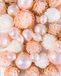 Rose gold and peachy pearl pink feather Christmas ornaments - make your tree shine with these beauties now available in store and online.