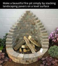 Homemade Fire Pit made from stone overs stacked on a flat service.