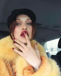 Bella Hadid - yellow fur + red lip