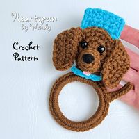 "**Click LEARN MORE ABOUT THIS ITEM to read FULL DESCRIPTION with PATTERN DETAILS **   CROCHET PATTERN for you to make a cute Dachshund Dog Kitchen or Bath Towel Holder Ring with fold-over button strap or a knob hole strap, for hand or dish towels.  Attaches to oven door, drawer handle, over a cabinet knob or on a hook.  EASY TO UNDERSTAND instructions, with detailed photos. Formatted for easy viewing and printing. Instant Download, PDF Format. SAVE up to 50% by purchasing this pattern as part o