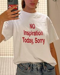 Embrace those off days with the "No Inspiration Today, Sorry" T-shirt. Perfect for the creative souls who sometimes just need to keep it real, this tee combines a humorous slogan with 2000s-inspired Y2K aesthetics. It's a must-have for any Gen Z fashionista looking to rock a laid-back yet stylish look. Whether you're scrolling through Pinterest or hanging out with friends, this shirt makes a statement. It also makes an ideal gift for the artist in your life who appreciates a touch of humor with