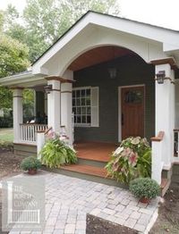 beautifully designed front porch with hip and gable roof. The Craftsman front door is a perfect fit.