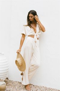 *THIS IS A FINAL SALE ITEM*Get luxe, poolside vibes in the Dion Resort Pants! They made from a soft woven fabric in a cream hue. They are a high to mid waisted style featuring wide floor length legs, zip and button closure and twin pockets at front. Complete the look with the Dion Resort Top and Rattan Backpack! Exclusively designed by Sabo.