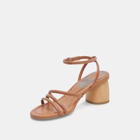 Tube-like straps and a wood-toned, substantial block heel give this sandal an ultra modern look. MIKAEL is your all-day and all-night heel that elevates all your warm weather looks Leather Upper Synthetic Outsole Synthetic Lining Synthetic Sock 2.4" Heel Height Imported