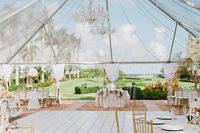 This white and gold wedding with clear tent was the perfect dream come true for this tropical, outdoor Miami wedding, the twinkle lights and chandeliers made it look straight out of a fairy-tale