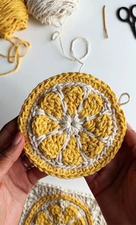 When life gives you lemons... make a bag... or something like that :)Here's a step by step tutorial on how to crochet a lemon/citrus square. The finished square is 5” x 5”. This square would be a fun building block for bags, hats, sweaters and more! Skill level : intermediate or adventurous beginnerMaterials • 2mm Braided Cotton Cord (Brand: Perfect Yarns / link) • color a (cream): 598 yards/547 meters • color b (yellow): 296 yards/ 271 meters (You can use yarn/cord of a different size but