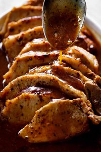 How To Make Easy Pork Loin Roast cooked with the most incredible Honey Garlic Butter Sauce! Oven and Slow Cooker Methods included!