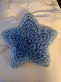 "Having a good soften star is the greatest thing to a good child. Double crochet in soft light blue yarn star shaped all the way and reverse single crocheted closure around the edge.  Makes an excellent gift for kid's birthday, holidays, personal achievement and baby shower 12 1/2\" x 12 1/2\" in (32 x 32 cm) Hand wash and dry flat"