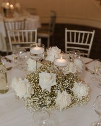 Flawless Functions on Instagram: "Candles + Baby’s Breath + White roses is currently the most trending wedding flower combination. It is classic and timeless. Loved creating this look for @rachelrizzo 🤍 #wedding #weddingday #weddingvenue #weddingcenterpiece #candlecenterpiece #babysbreathwedding #whiterosewedding #weddingtablesetting #weddingtrends #weddinginspo #bride #bridal #ctbride #ctwedding #bridalshower"