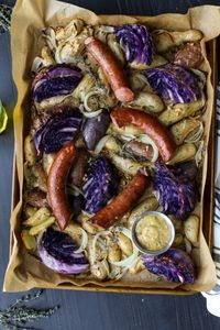 Sheet Pan Kielbasa, Cabbage, and Potatoes | An easy budget-friendly, weeknight whole30 dinner that’s packed with hearty winter veggies and flavor. The best part, aside from the taste, is that clean up is a breeze when you line the pan with parchment paper or a silicone baking mat. Try out this delicious paleo recipe that the family is sure to love. || The Real Food Dietitians