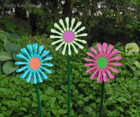 Create some fun and funky repuprosed dollar store clothes pin flowers to add some whimsy to your garden or outdoor spaces.