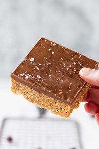 A "healthier" version of your favorite childhood snack - using honey instead of corn syrup! The irresistible topping doesn't change a bit: milk chocolate swirls with butterscotch for the perfect topping on the peanut butter bars!