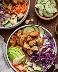 This Bang Bang Chicken Bowl is cubes of chicken tossed in a creamy, spicy Bang Bang sauce served over rice with crispy vegetables. Then, each bowl is topped with avocado, cilantro, and sesame seeds for a burst of freshness and texture.