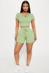 Available In Pink And Sage. Active Top Crew Neck Half Zip Short Sleeve Seamless Ribbed Medium Impact Stretch Pair / Mix And Match With "Total Body Active Short" 90% Nylon 10% Elastane Imported | Total Body Active Top in Sage size XS by Fashion Nova